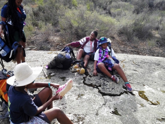 Resting those feet and checking for blisters.
