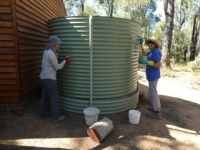 Jennifer and Sandra clean the tank