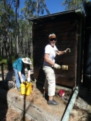 Susan and Nola oil the toilet cladding