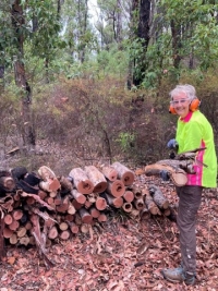 Charmaine helps top up the firewood
