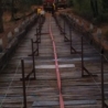 Crews do all they can to prepare the bridge for the impending fire.
