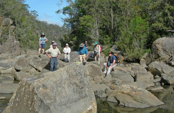Rock hopping along the river bed.