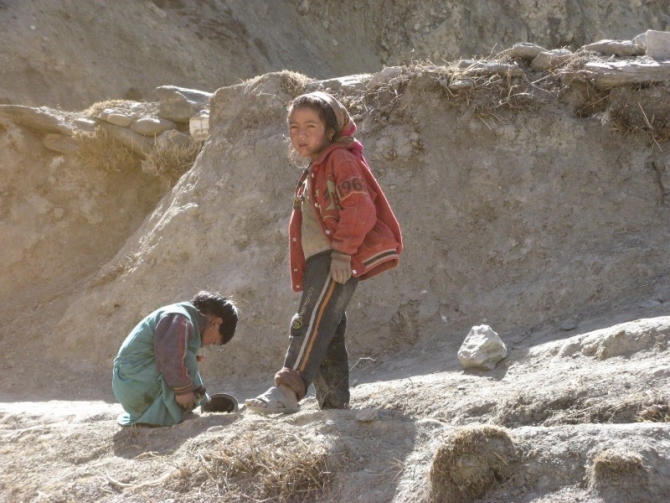The local kids are wary of trekkers.
