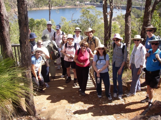 Walkers reach a viewing platform above the Mundaring Weir on their way to the pub.