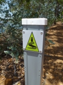 The Wellington Spur Trail trail is marked with a green Waugal trail marker.