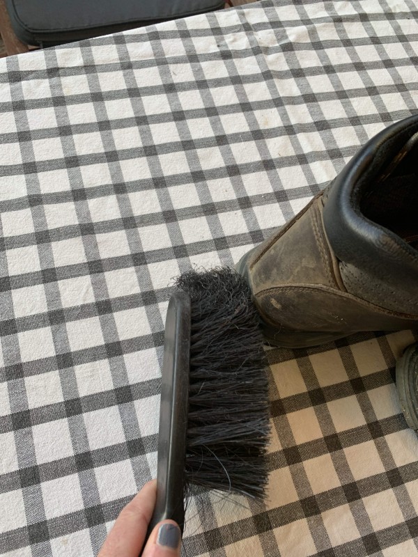 Cleaning my boots with a brush