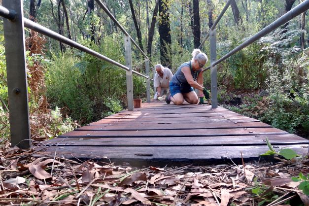 Maintenance volunteers Hedley and Lari working on their section near Dwellingup