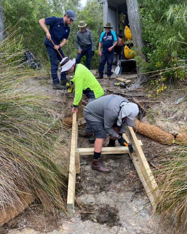 Timber frame pinned to the ground